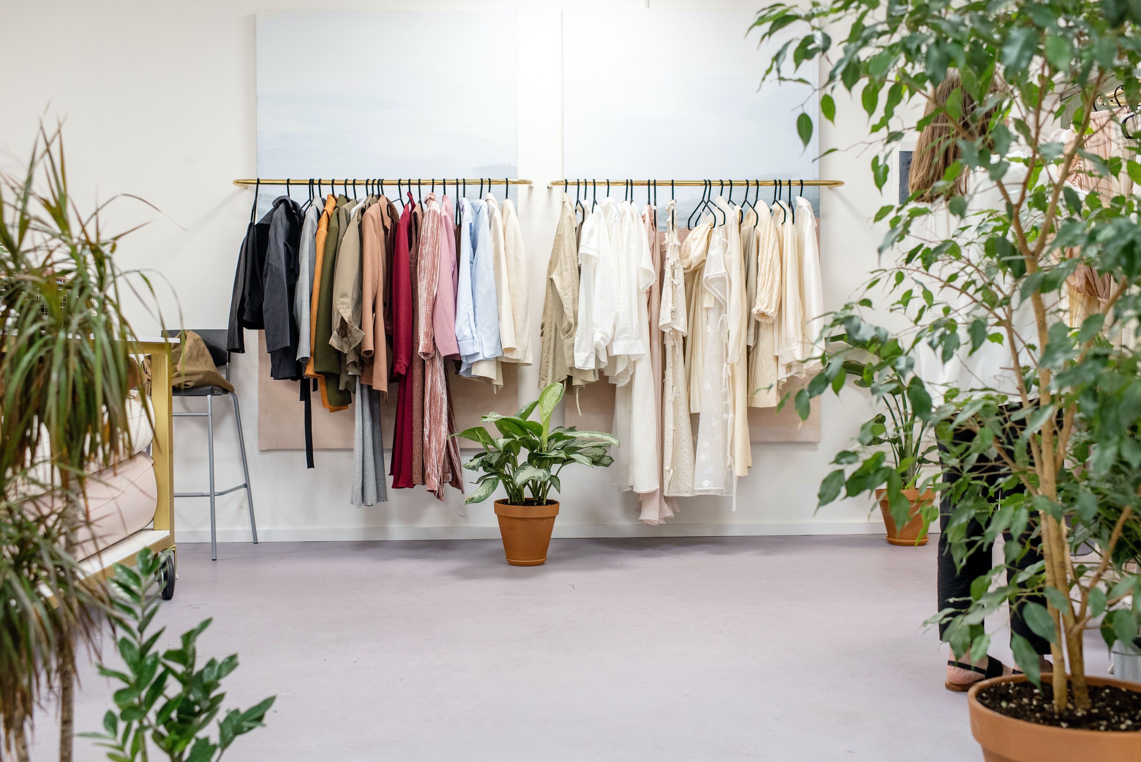 clothes hanged on clothing rack