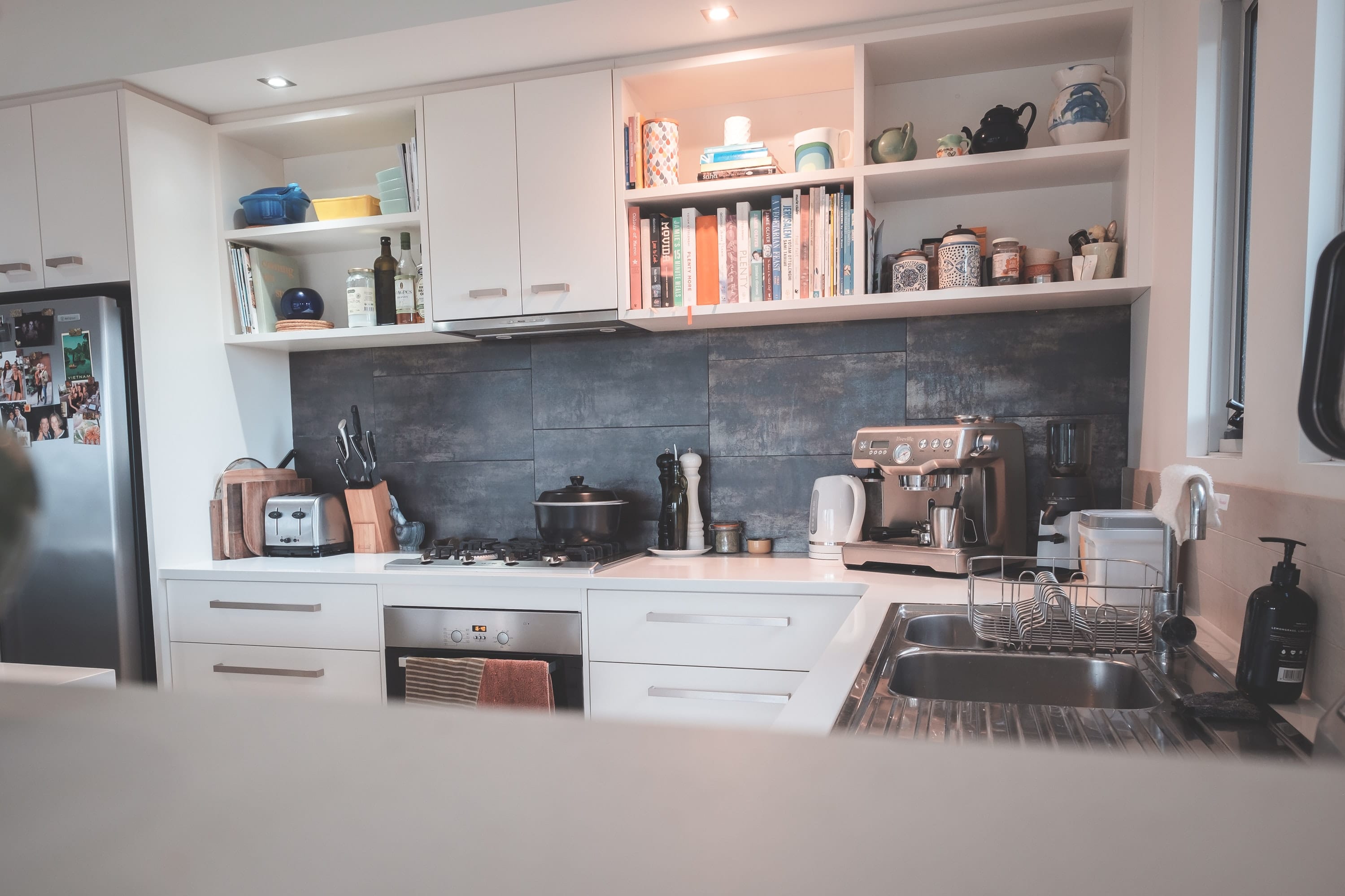 Kitchen with minimalist furniture and modern appliances