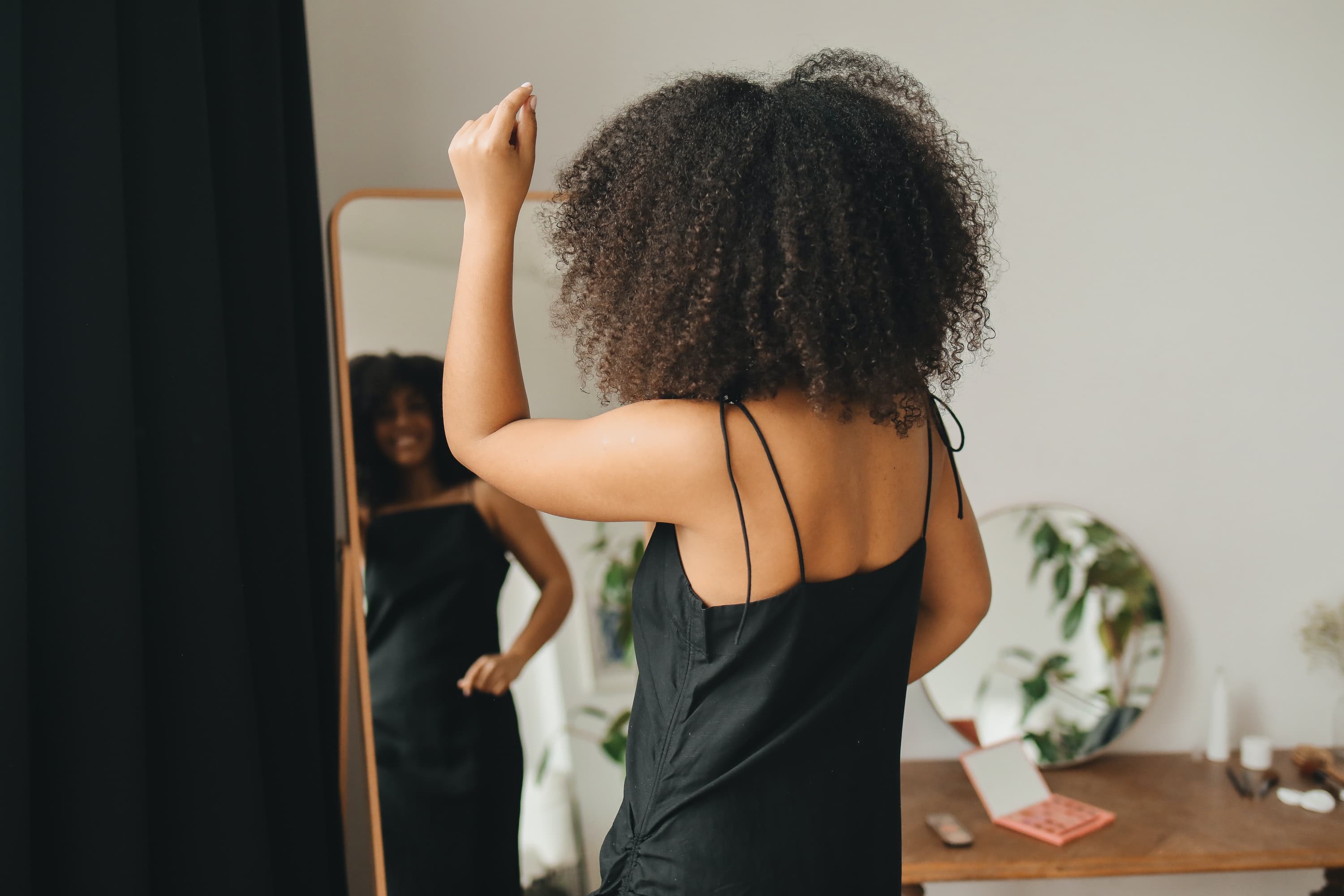 woman in a spaghetti black dress