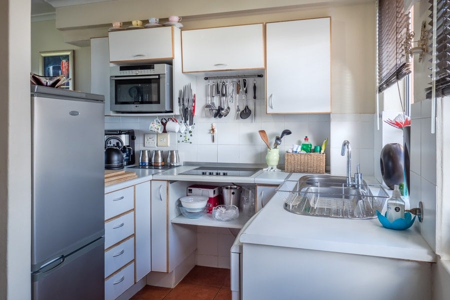 Photo of white wooden kitchen cabinet
