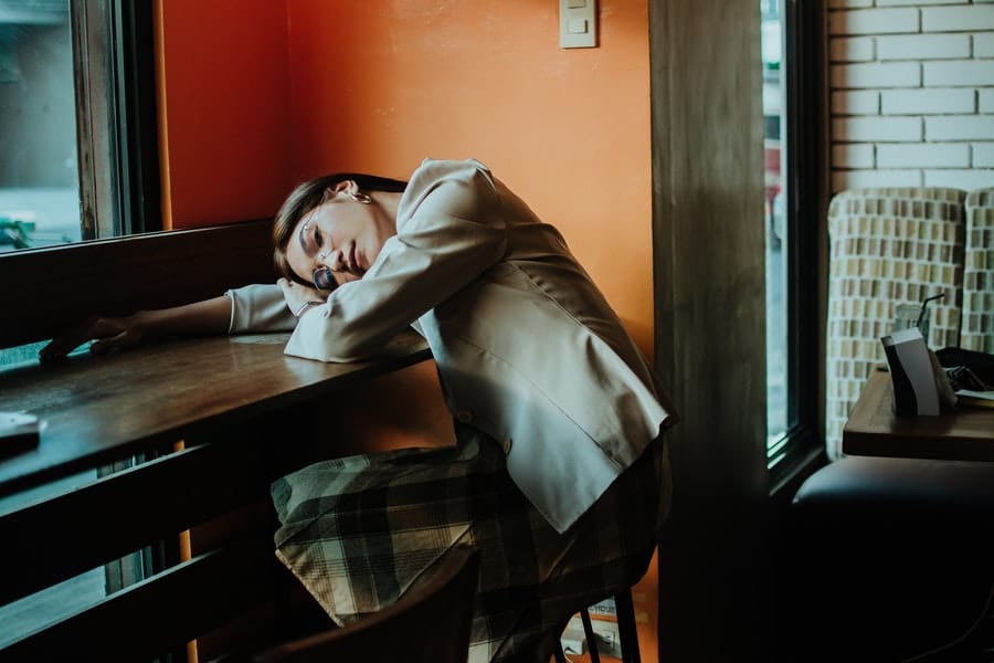 Woman in office clothes taking a nap