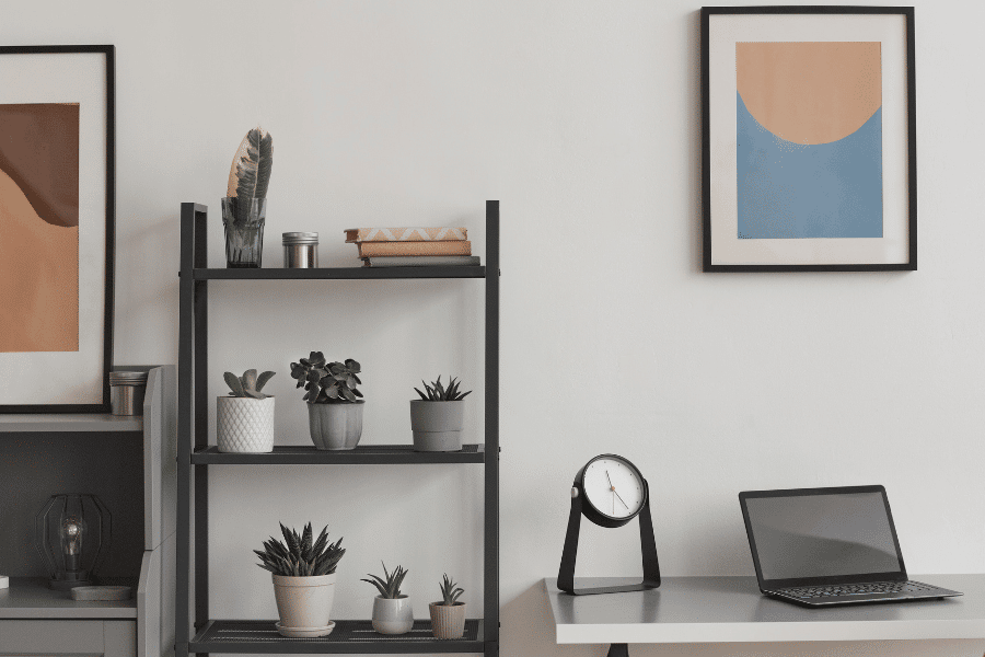 Home office with plants and wall painting