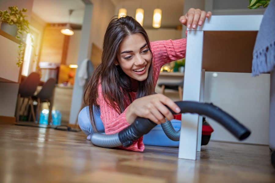 a woman happily doing extra chore